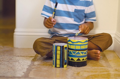 toddler playing with drum