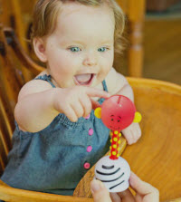 baby with musical toy